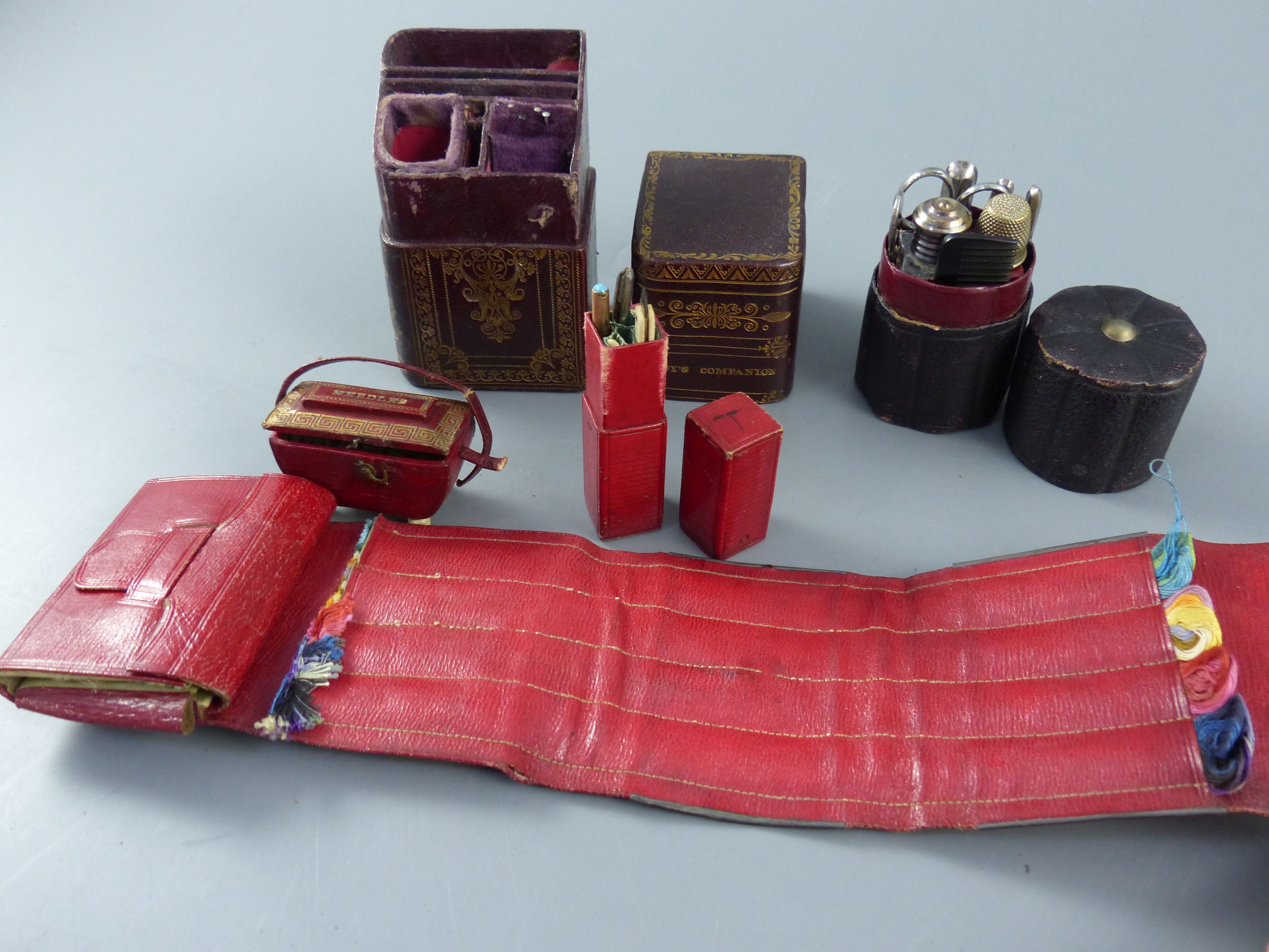 A group of early 19th century and later leather sewing cases